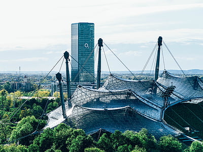 o2, munich, o2 tower, architecture, glass facade, discs, office building