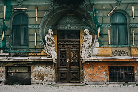 two, white, statuettes, arched, door, frame, building