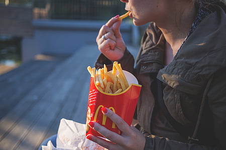 close-up, coat, eating, fast food, female, fingers, food