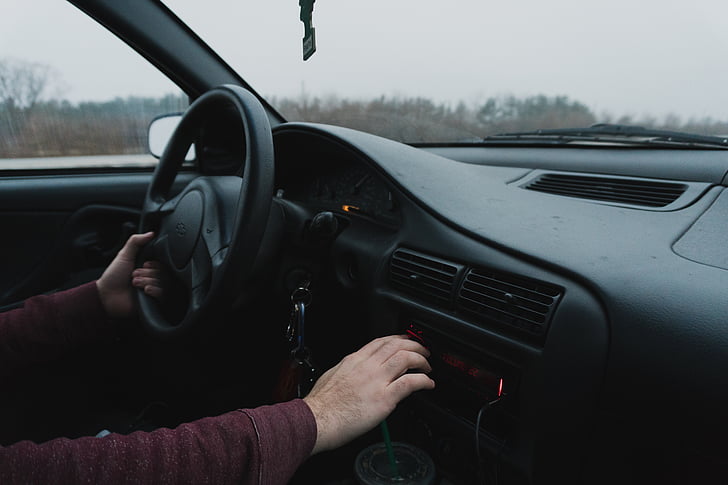 person, holding, black, car, steering, wheel, daytime
