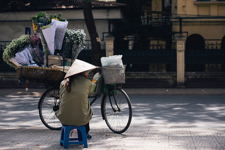 street, vendor, seller, people, woman, hat, sitting