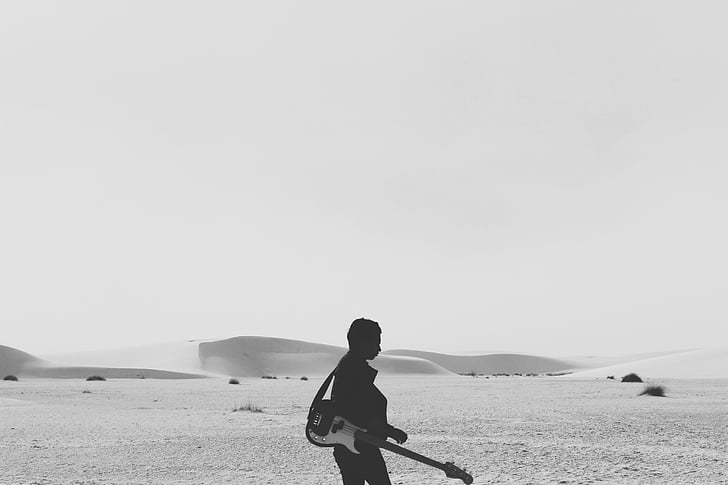 grayscale, photography, man, holding, electric, guitar, desert